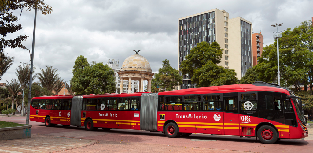 A three-car Transmilenio bus crossing the Parque de los Periodistas Gabriel García Márquez in Bogota, Colombia. Photo by Alejandro Bernal.