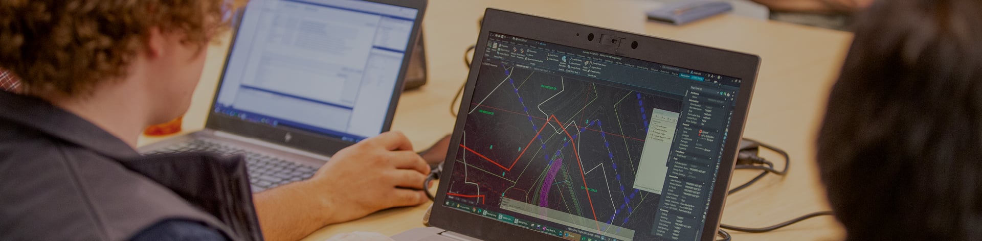 We Innovate: A VHB team member works on model-based design technology on their laptop.