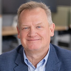 Andy Gillespie smiling at the camera.