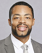 Jarrell Smith wears a gray suit and tie