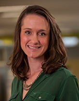 Katie Shannon smiling in a green shirt