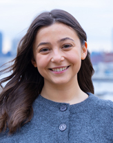 Lindsey Cassone smiling with a highway in the backdrop.