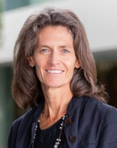 Megan Raymond smiling outdoors.