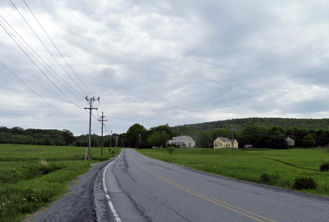 Power lines along the roadway keep communities connected.