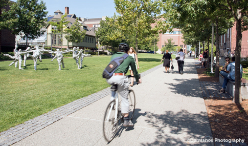 Students on campus near green at Brown University in Providence.