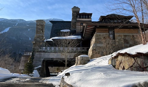 View of entrance leading to Switchback Terrace Drive set within the mountains in winter.