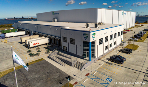 Birds eye view of the rear entry of Lineage Cold Storage Facility depicting loading areas, outdoor seating, handicap ramps and adjacent employee parking. 