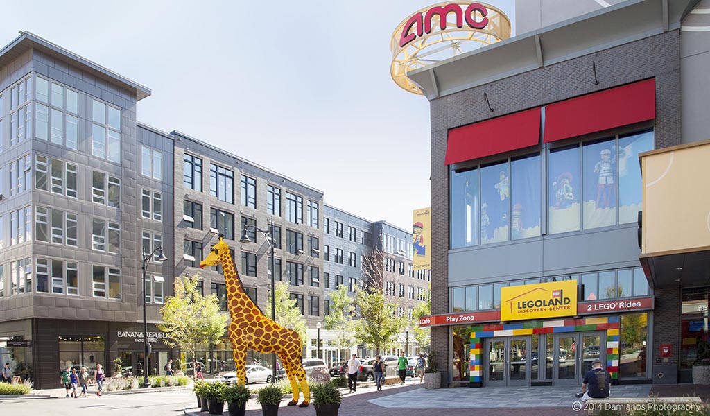 A giraffe statue welcomes visitors outside of the Lego store at Assembly Row.