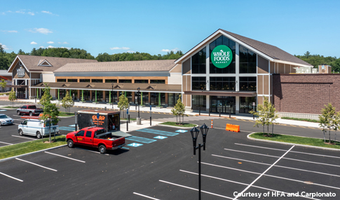 Exterior of Whole Foods Market and associated parking lot.