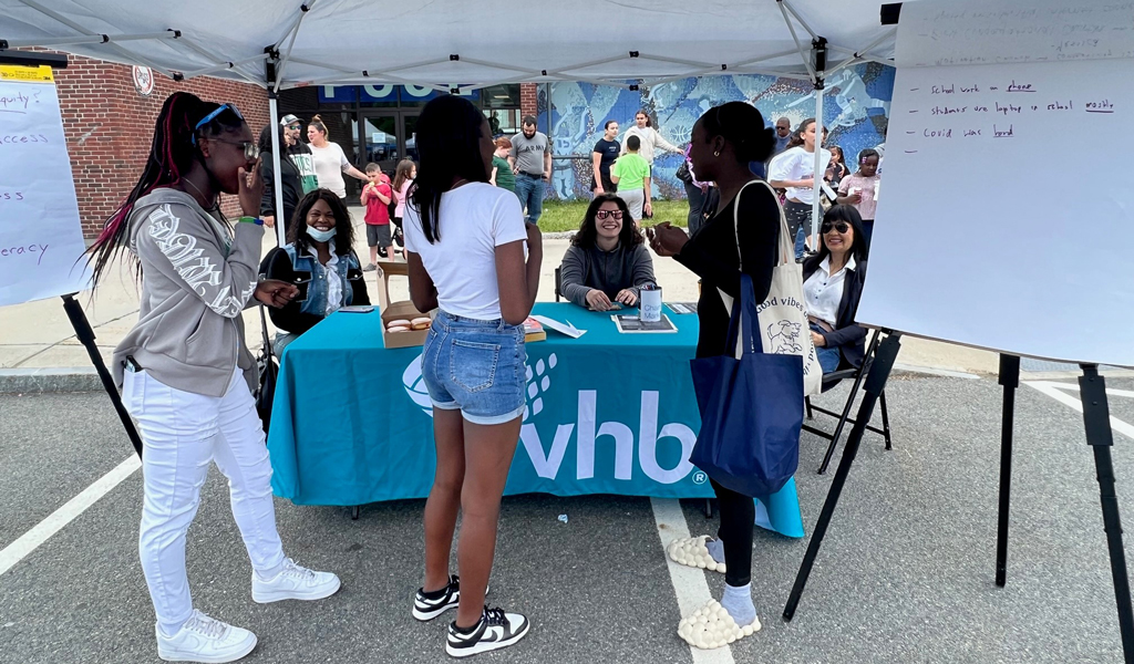 VHB staff engage with members of the Randolph, MA community at an outdoor event.
