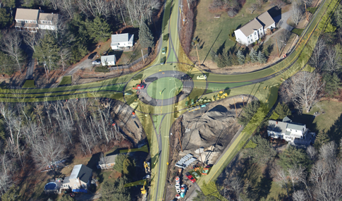 Proposed roundabout design overlay on original intersection