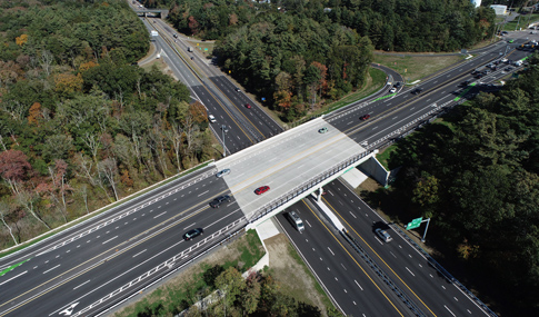 Aerial image of newly constructed bridge carrying Route 44 over Route 24 in Raynham, MA