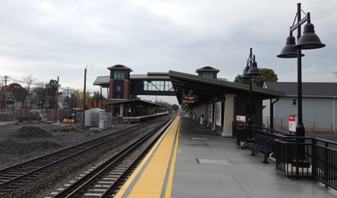 The Wallingford, CT station double-lined track with pedestrian overpass & stair tower.