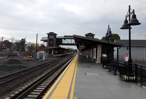 The Wallingford, CT station double-lined track with pedestrian overpass & stair tower.