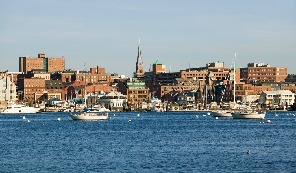 Portland, Maine skyline with city and ocean surrounding.