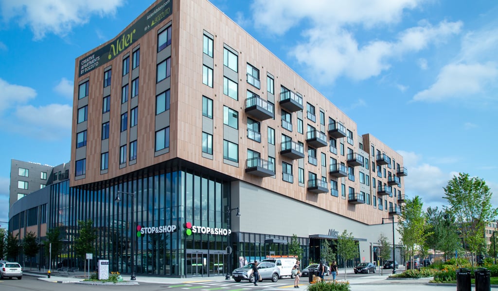 A 4-story residential building with Stop & Shop on the ground floor in Allston, MA.