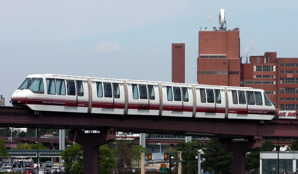 Newark International Airport AirTrain transporting passengers across the airport complex.
