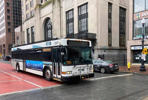 RIPTA bus at a downtown intersection