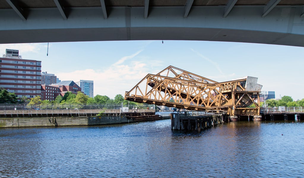 A drawbridge with both tracks beginning to rise.
