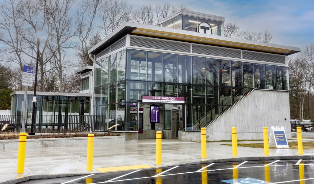 A glass train station building.