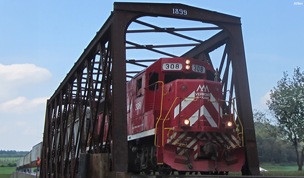 Vermont Rail System locomotive 308 crossing restored 1899 railroad bridge, rebuilt after Hurricane Irene damage.