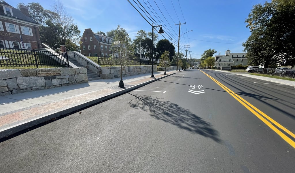 Improved Madbury Road corridor in Durham with bike lane and sidewalk.