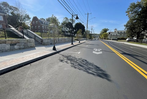 Improved Madbury Road corridor in Durham with bike lane and sidewalk.