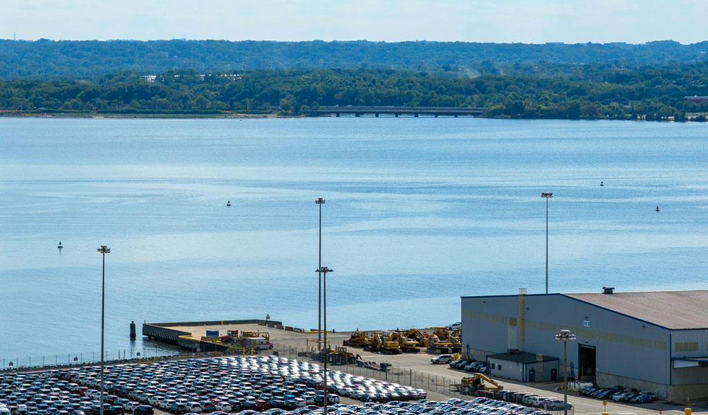 Aeriel view of the Patapsco River with industrial buildings lining the waterfront. 