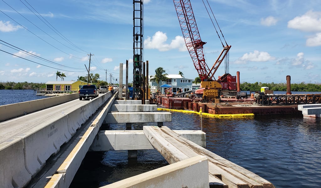 Construction shot of Little Pine Island Bridge on a sunny day with blue sky. 