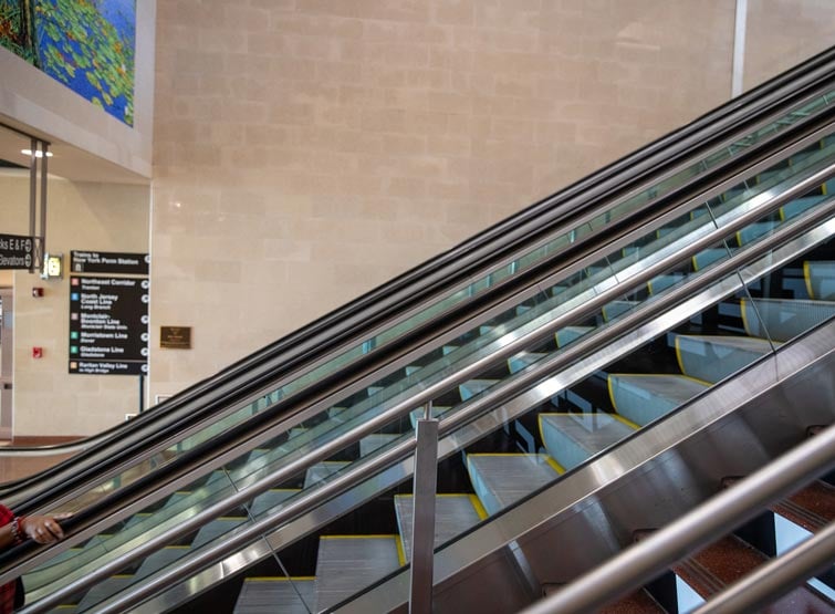 A close-up of an escalator.