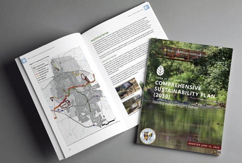 The Hillsborough Sustainability Plan front cover and opened book showing a map of the study area. 