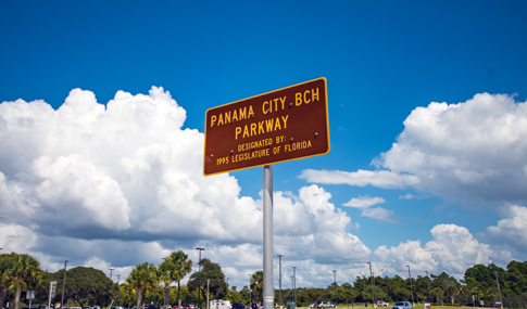 A brown road sign that reads Panama City Beach Parkway as designated by the Florida Legislature in 1995.