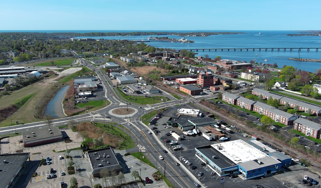 A bridge onramp with ocean in the background.