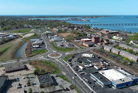 A bridge onramp with ocean in the background.