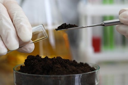Person conducting soil studies soil as part of Environmental Forensics & Litigation Support.