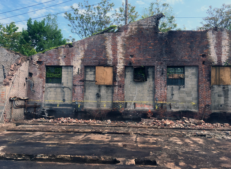 Abandoned masonry building that required building assessment and waste characterization prior to demolition.