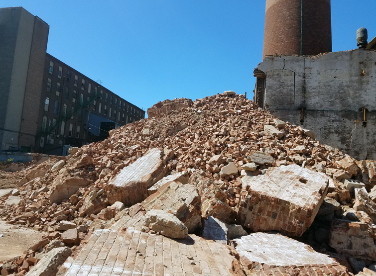 Large pile of bricks from ongoing industrial building demolition. 