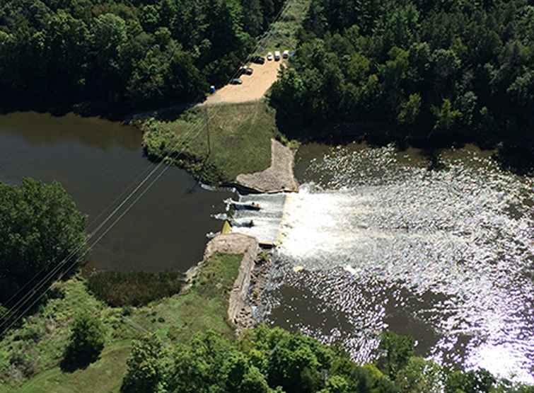 Kalamazoo River flowing over. dam.