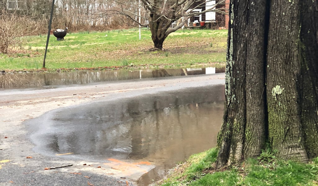 A flooded residential road.