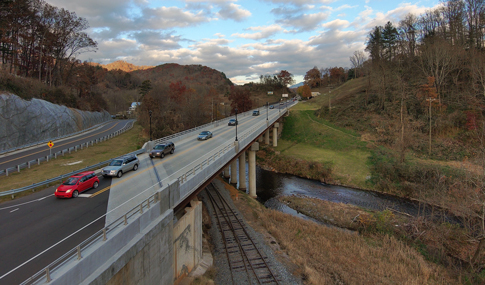 Vehicles waiting at a traffic light on the Dillsboro Bridge replacement.  
