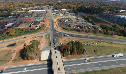 Construction of the existing diverging intersection over I-77 looking east.