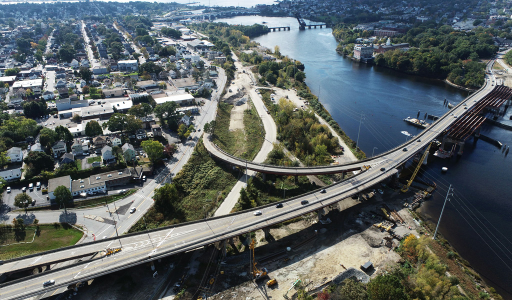 An aerial view of a bridge being constructed over water.
