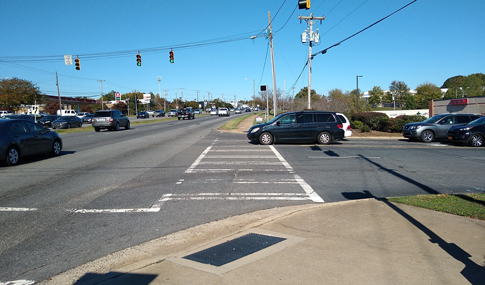 Cars driving down a roadway in Charlotte, NC. 