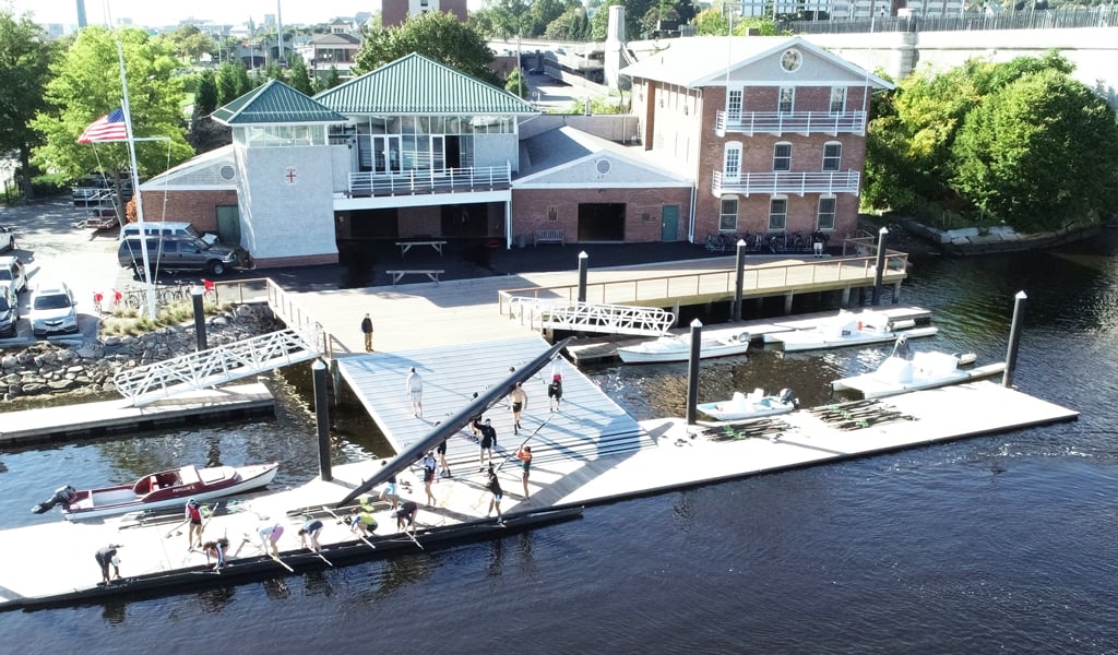 A crew team prepares to row from the Martson Boathouse dock.