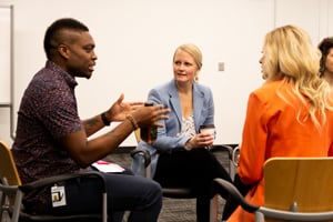 Three VHB team members deep in conversation