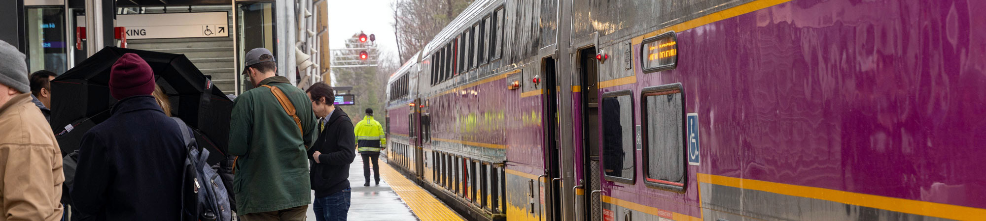 An MBTA train at a passenger rail station.