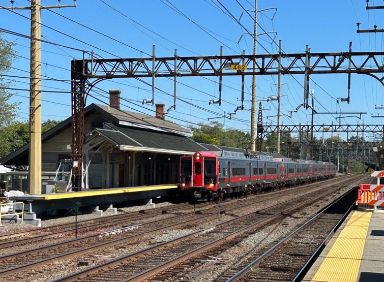 A red train on the tracks.