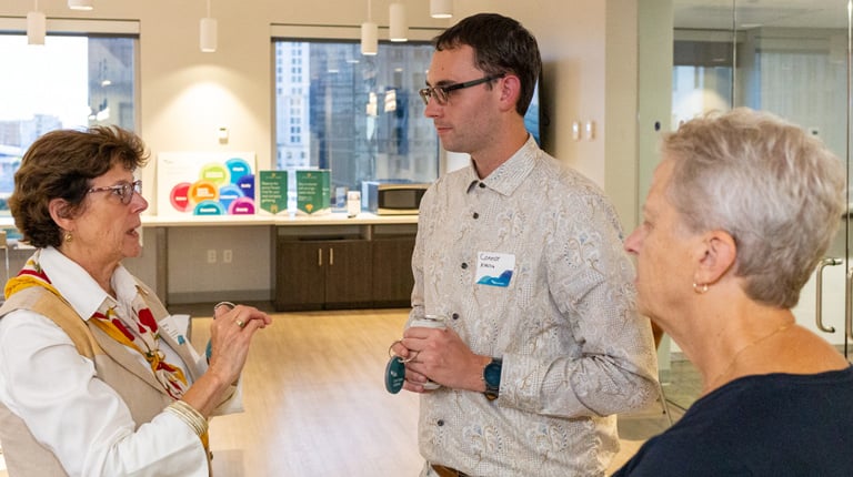 Nancy Barker and Connor Burke engage in conversation. 