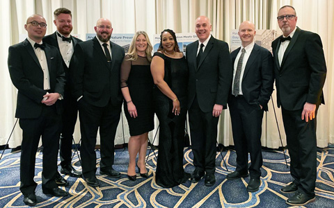 Group of VHB employees smiling together. 