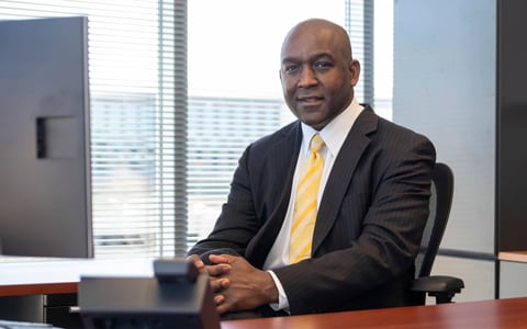 Reggie Scales smiles at the camera. 